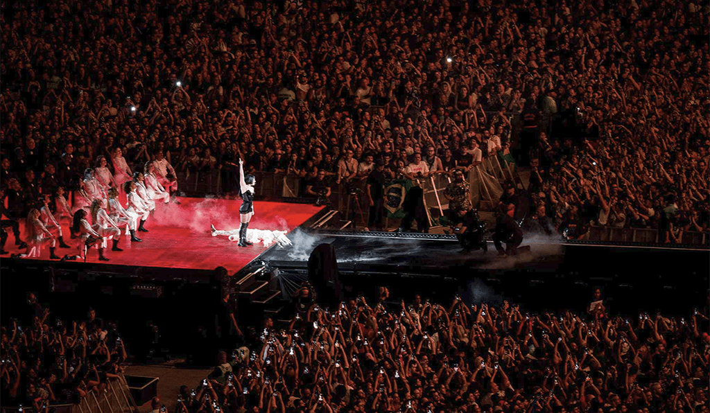 a group of people standing on a stage with a stage