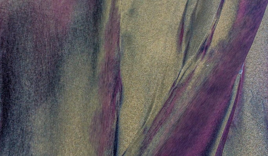 close-up of Pfeiffer Beach’s natural purple sand patterns