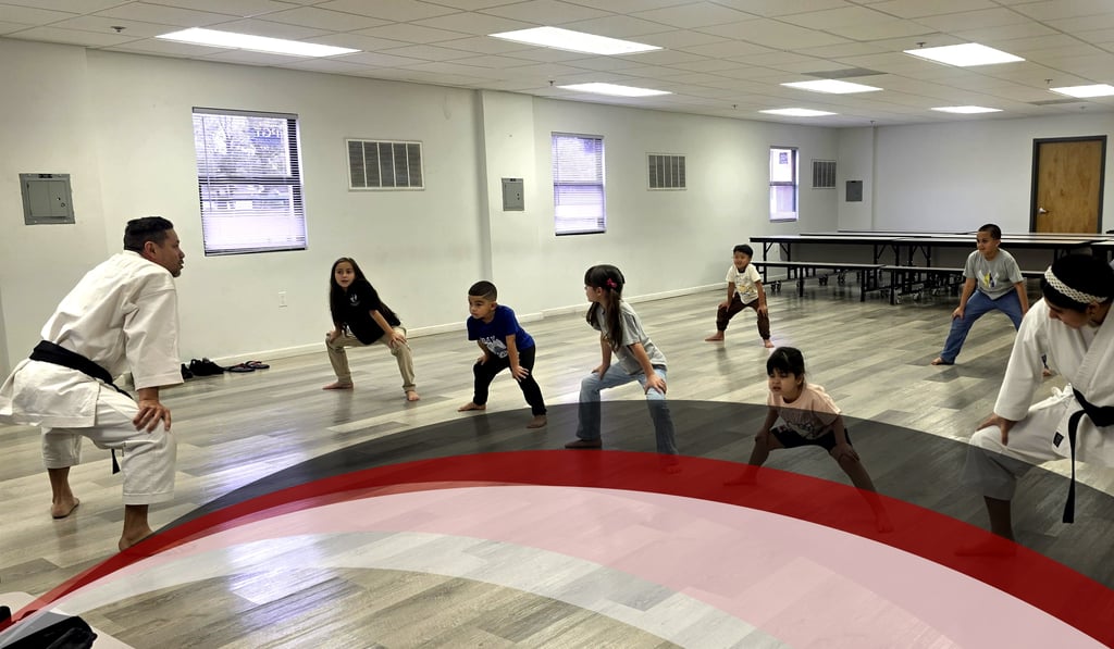 POK students practicing traditional Goju Ryu karate techniques