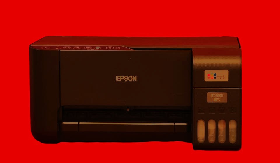 a printer printer with a red background and a black and white printer