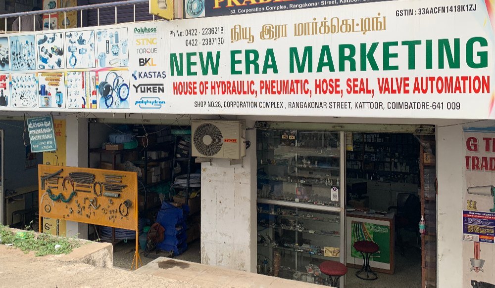 Shop outside photo of New Era Marketing. Main road facing shop in Rangakonar street, Kattoor