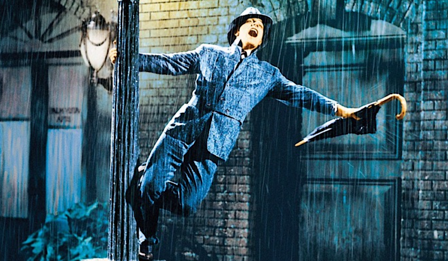 Gene Kelly sings on a lamppost with umbrella during ‘Singin’ in the Rain’ (1952)