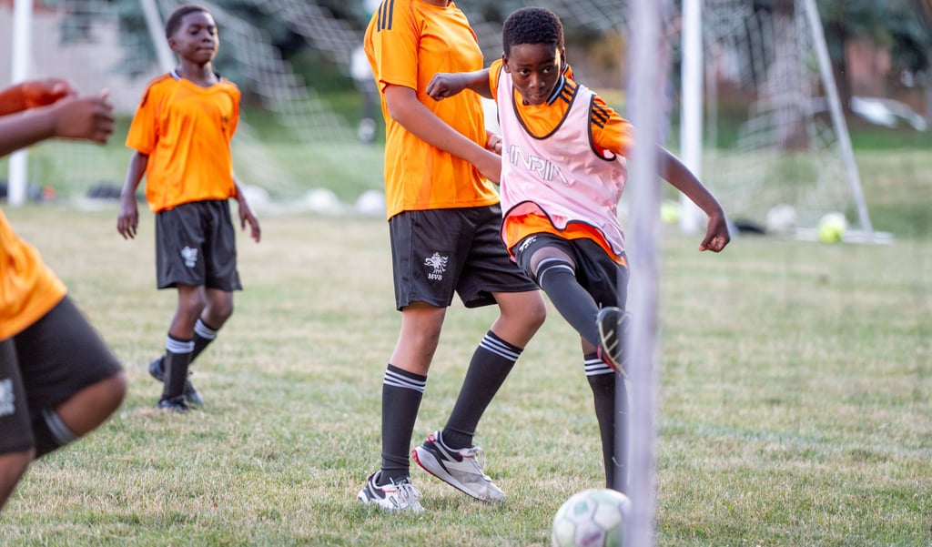MVB F.C. Soccer player kicks a soccer ball during soccer practice outdoors Mississauga