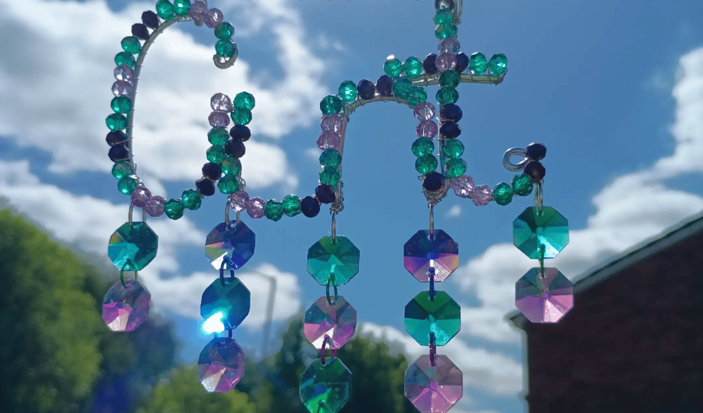 A deep ocean inspired cunt suncatcher called The Sea Witch