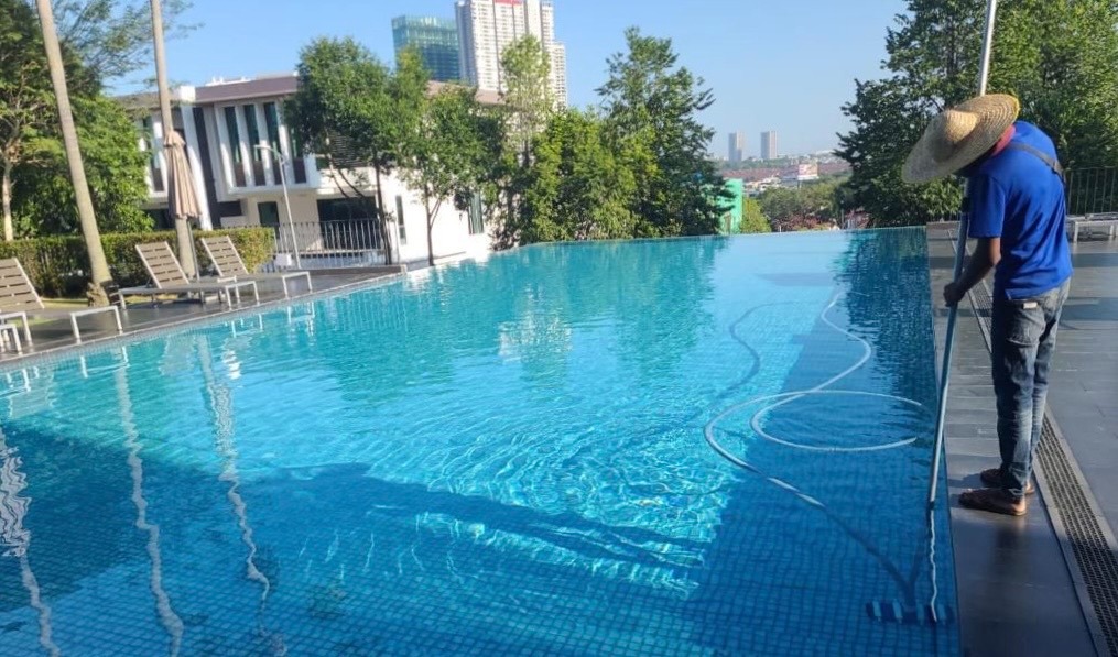 Crystal-clear swimming pool cleaning by TOT Cleaning & Landscape Sdn Bhd.