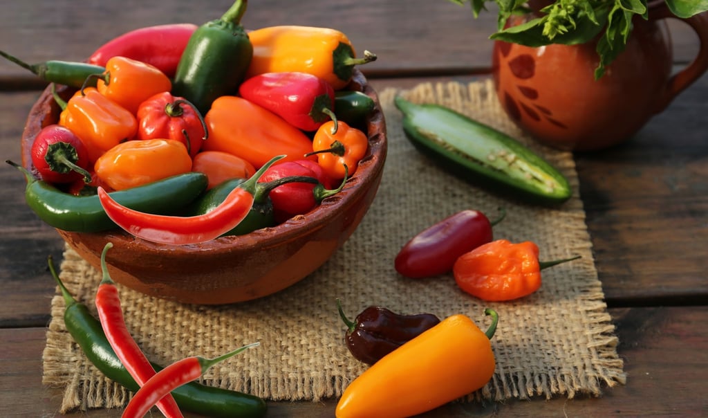 a bowl of peppers on a table
