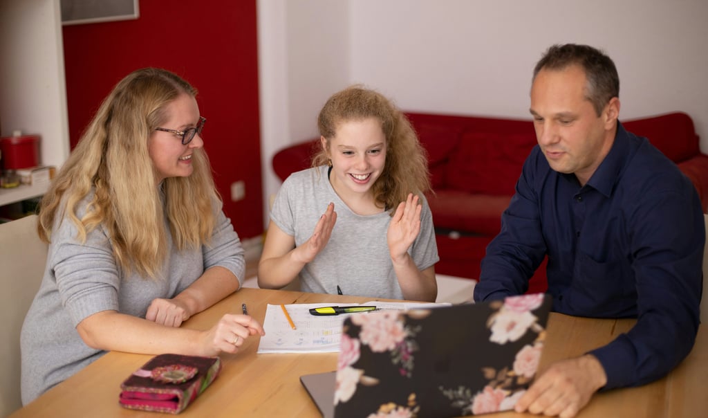 Happy supportive parents that are satisfied with the succes that their child is making