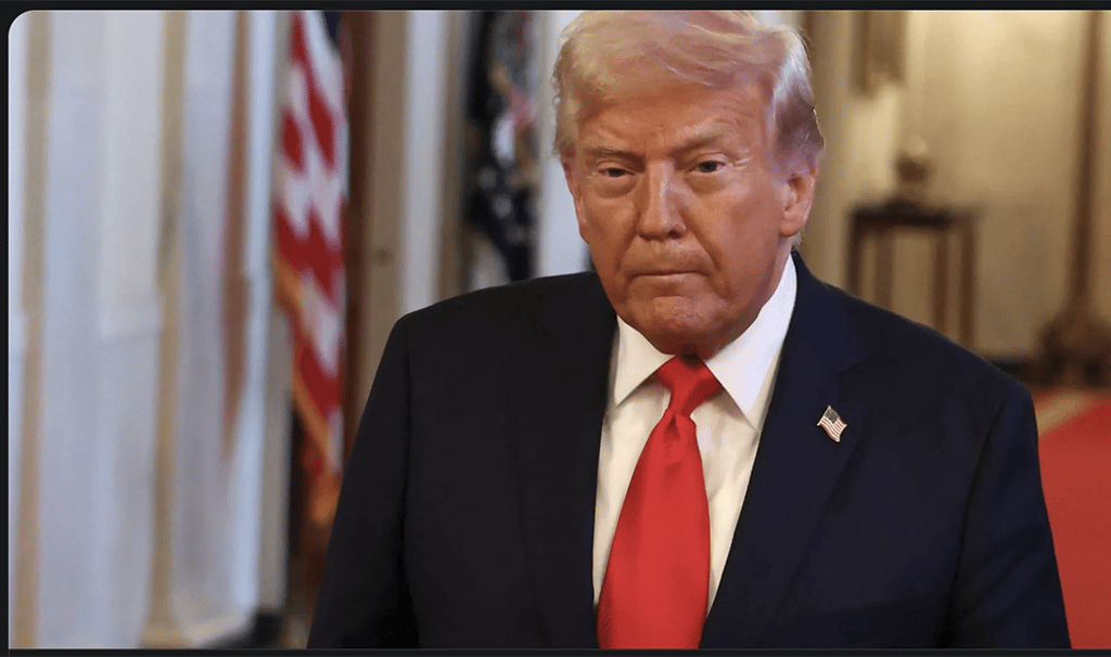 a man in a suit and tie with a red tie