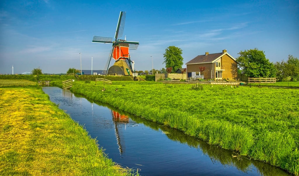 Windmills and water canal in Kinderdijk, Holland or Netherlands