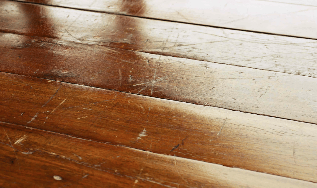 Scratched and damaged wood floors.