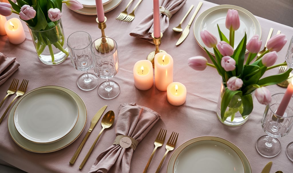 a table setting with candles and candles