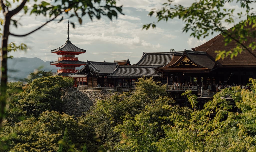 a large building with a tall tower in the background