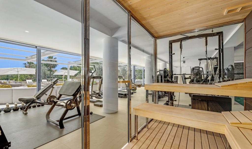 Glass sauna and gym with ocean views
