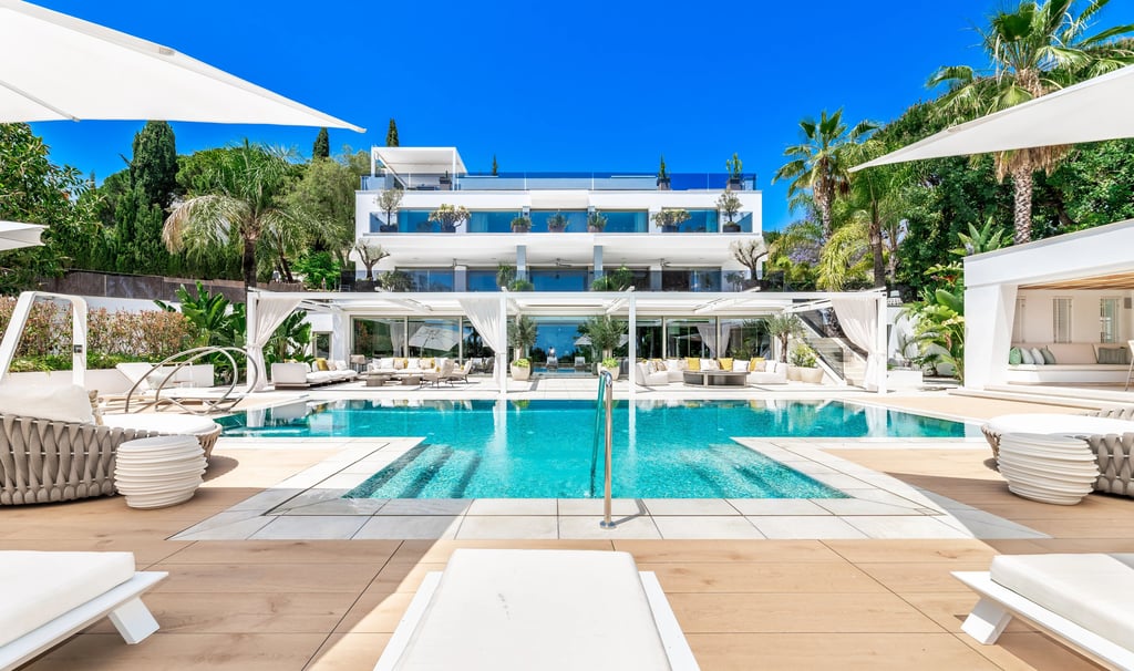 Modern villa exterior with expansive pool area