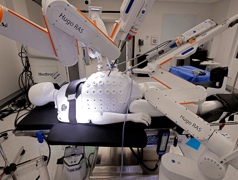 a robotic hand held up to a robotic hand
