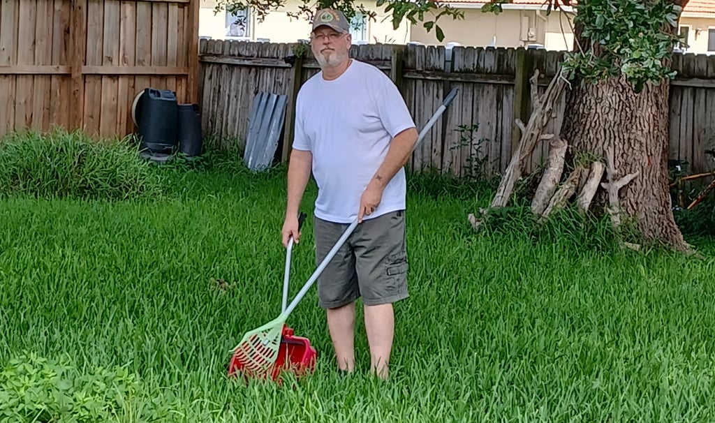 Robert Removing pet waste from yard