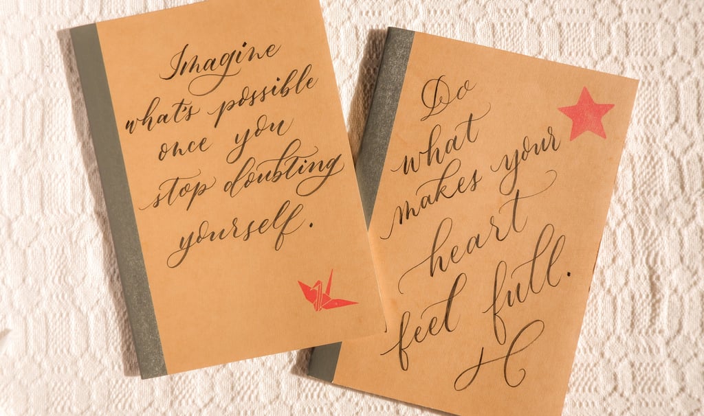 Personalized journals with handwritten calligraphy for an activation in NYC by Handwritten by Belle.