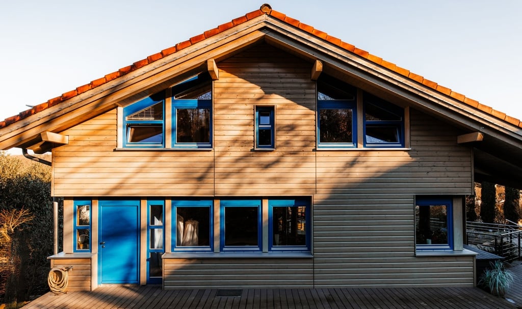 a house with a blue door and harmonic colors