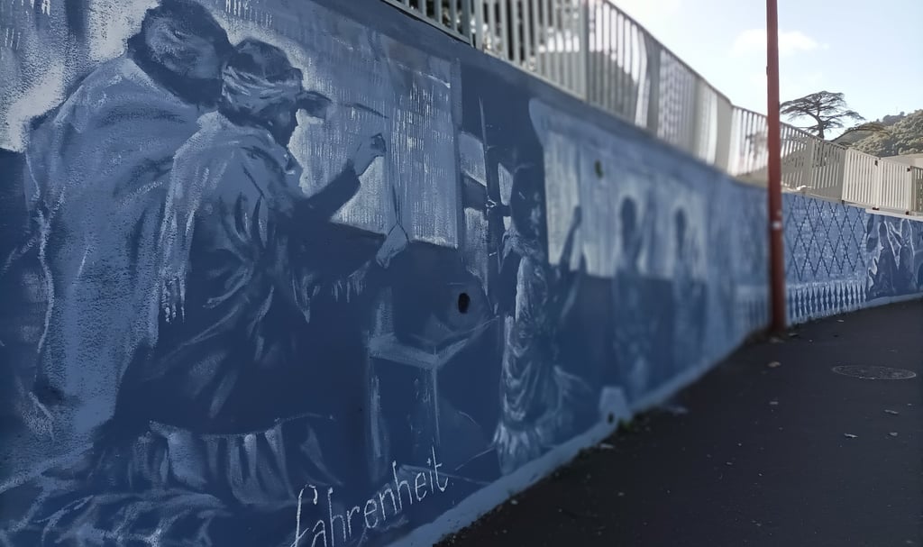 Roadside mural showing the first workers at The Savonnerie.