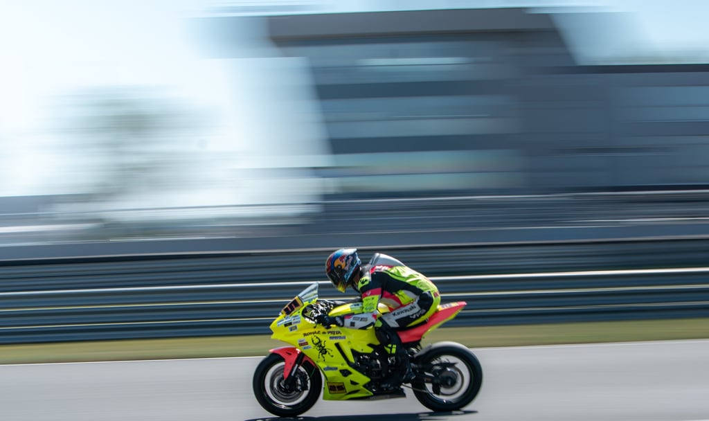 a person riding a motorcycle on a track