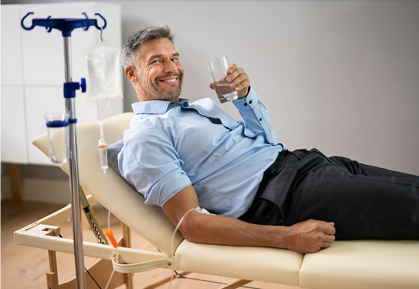 Specialized physician applying IV therapy with essential vitamins to strengthen the body, enhance th
