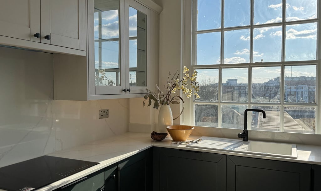 a kitchen with a sink and a beautiful view from the window
