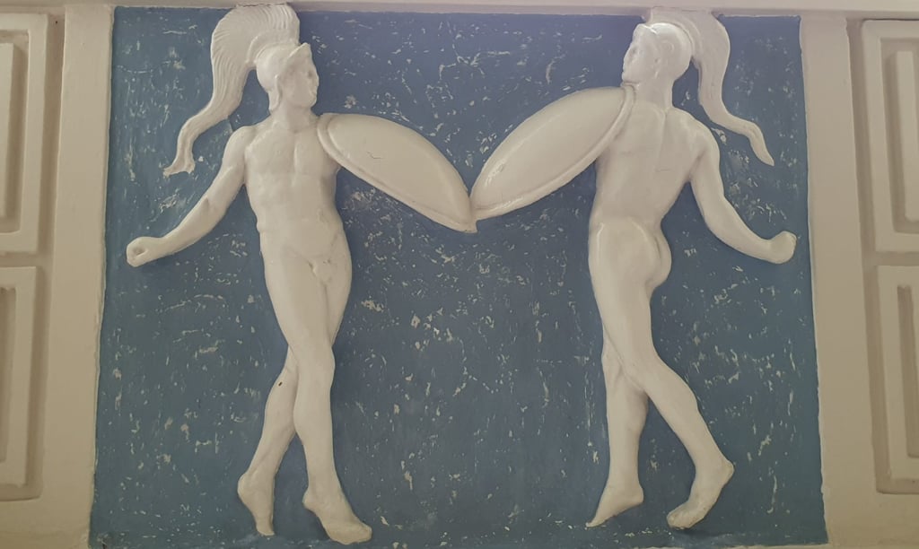 Two dancers depicted in the plaster decoration at Braxted Park