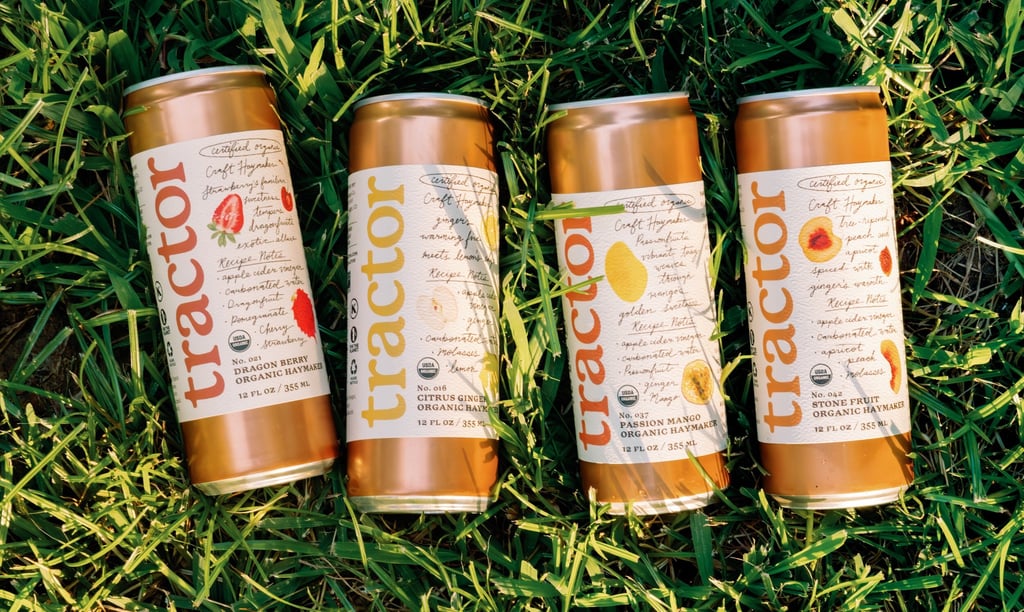 three cans of iced tea on the grass