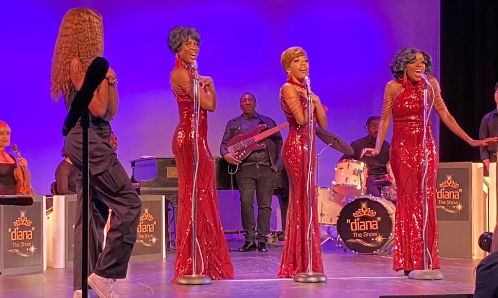 a group of people standing on a stage