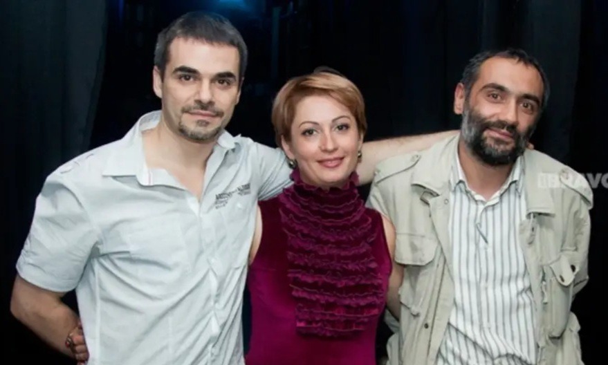 Three Armenian actors posing together against a dark background in professional casual attire.