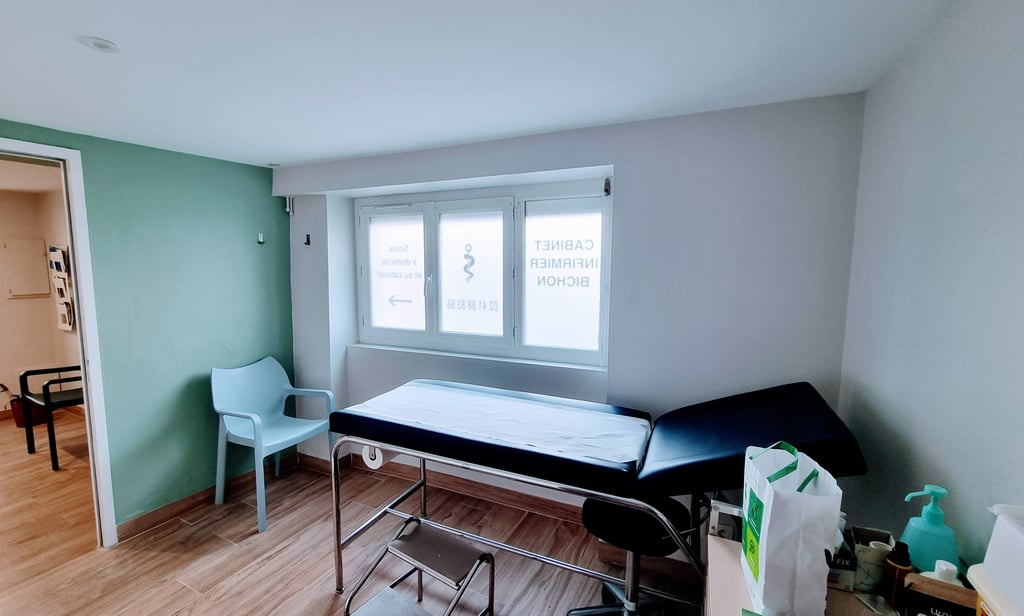 a bed in a room with a bed and a chair