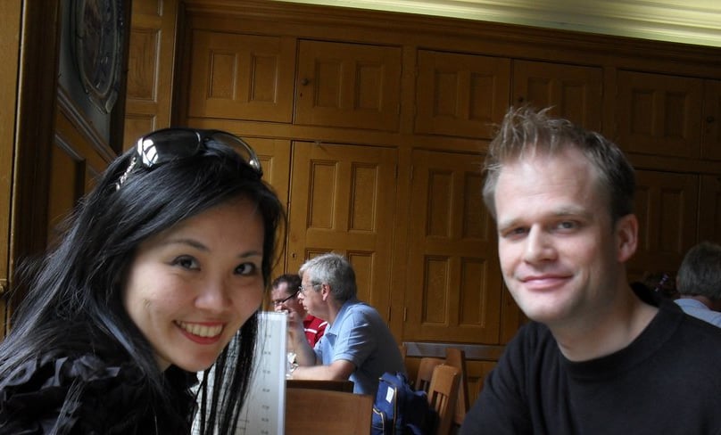 a man and woman sitting at a table