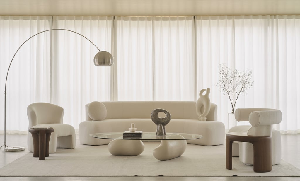 a living room with a couch and chairs