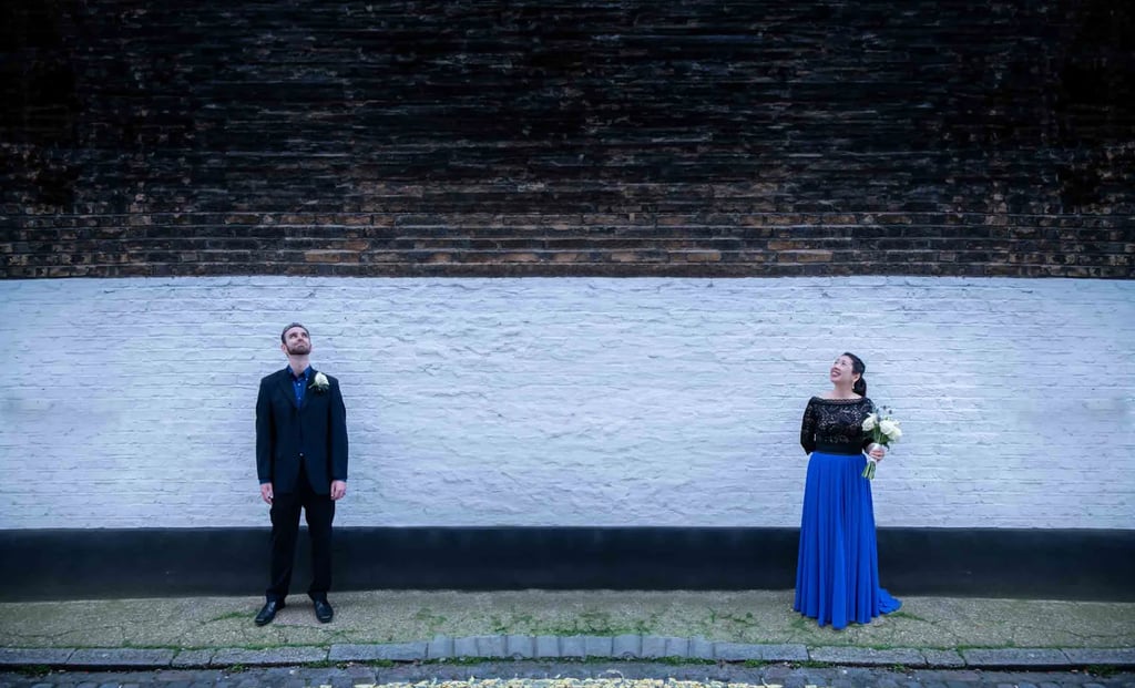 Newly-weds walking around the quiet streets of Marylebone after being married at Old Marylebone Town Hall