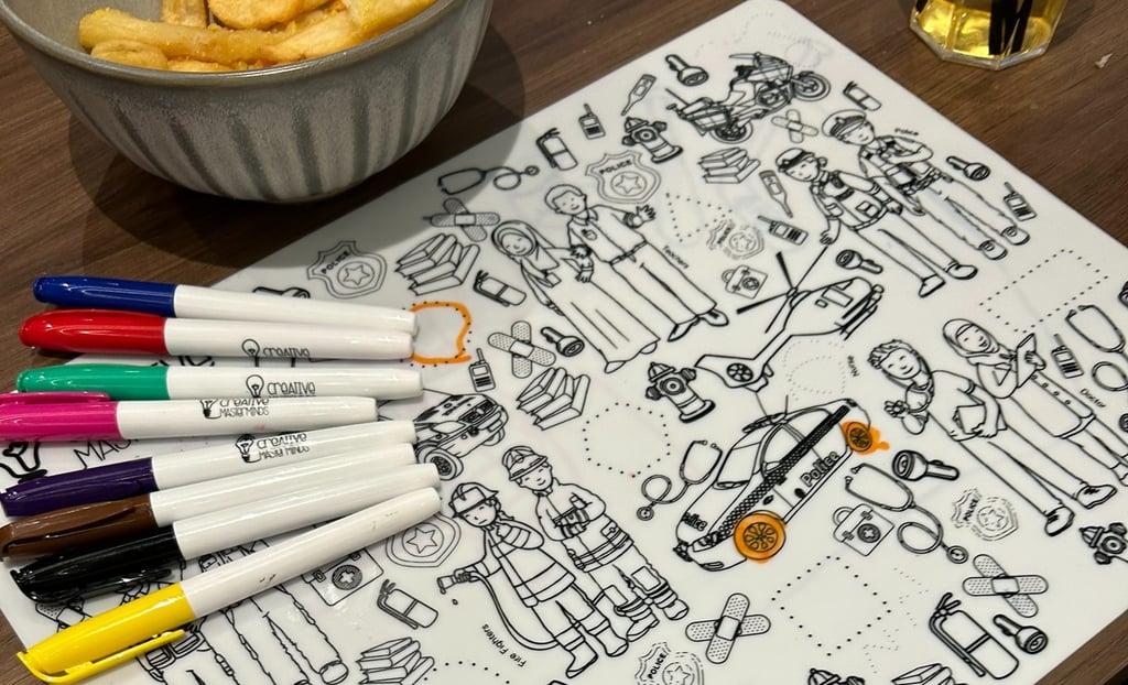 Child learning about doctors and firefighters on Scribbly Kids Community Heroes mat