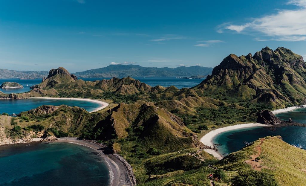 a view of a beach with a mountain in the background