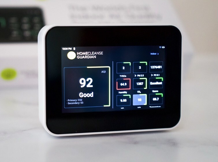 HomeCleanse Guardian indoor air quality monitor displaying CO2 and humidity levels.