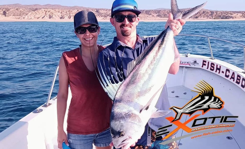 a man and woman holding a fish fish