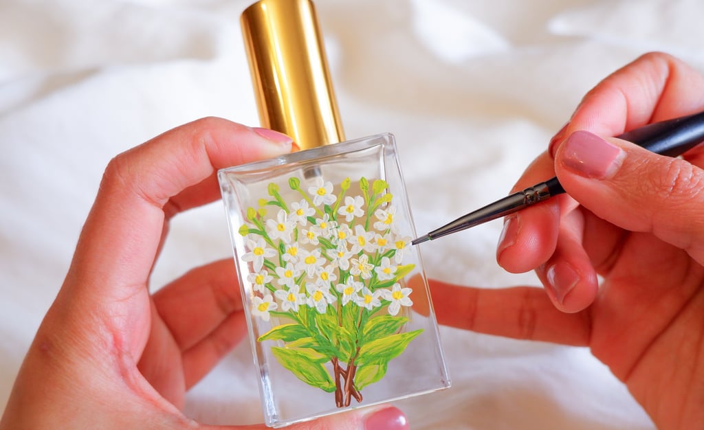 Perfume bottle personalized with floral painting by NYC live event artist Handwritten by Belle.