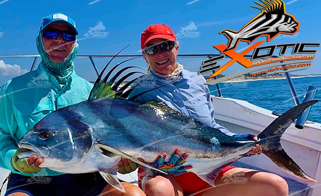 two people holding a fish on a boat