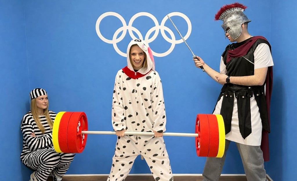Family having fun at Selfie Experience Museum in Split, posing in themed costumes
