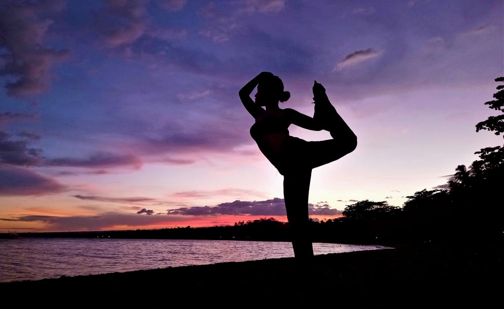 Dauin night scene with girl doing Yoga