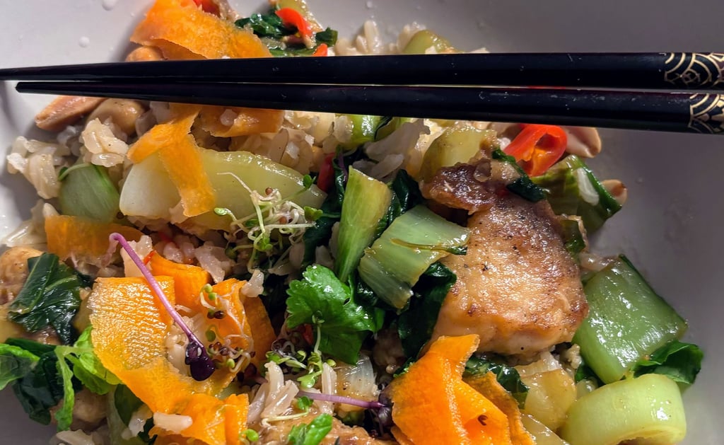 Vietnamese-inspired chicken with garlic rice, pak choi, pickled carrot, chili, and herbs