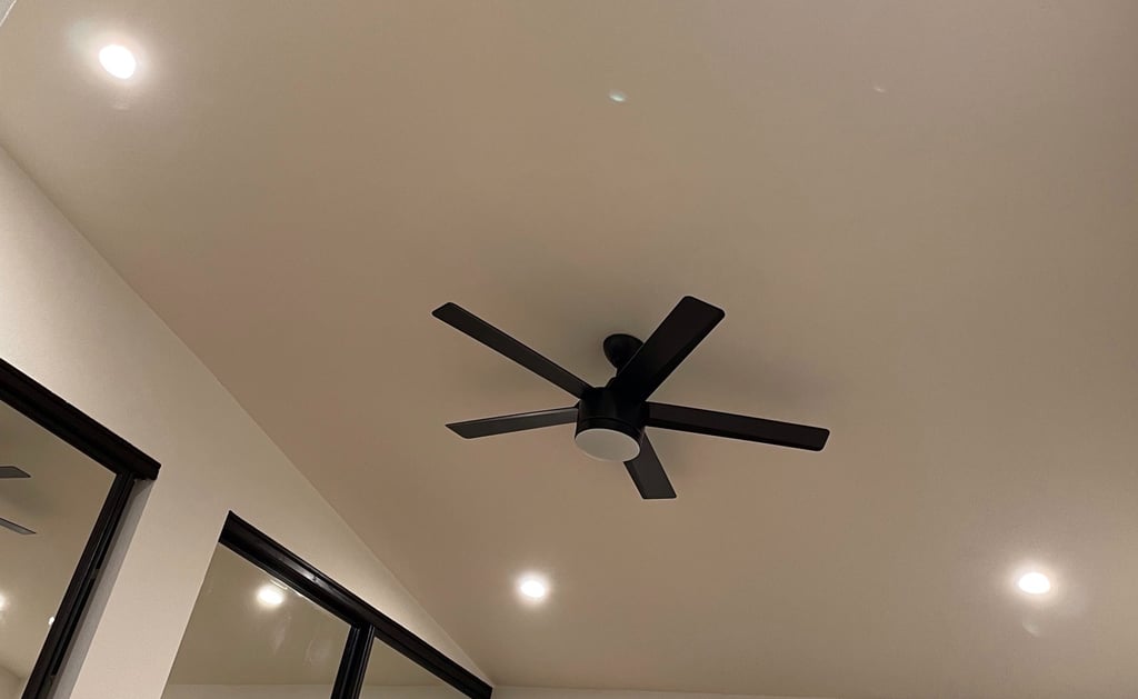 Room with recessed lights and ceiling fan