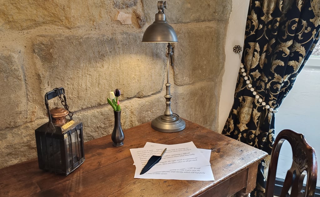 Writing desk with pen lamps and flowers