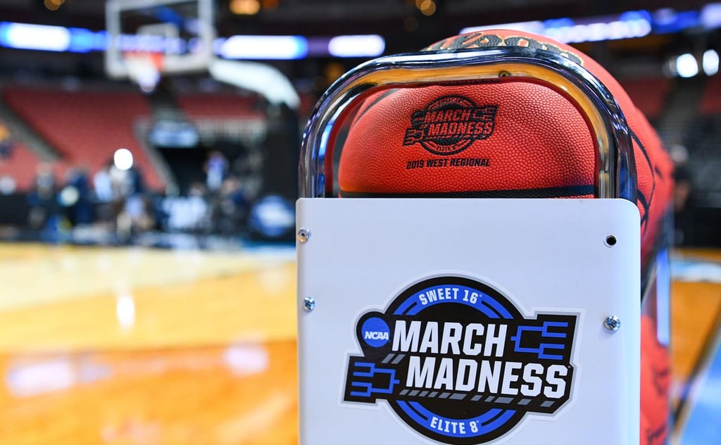Basketball on a rack with NCAA March Madness 2024 logo