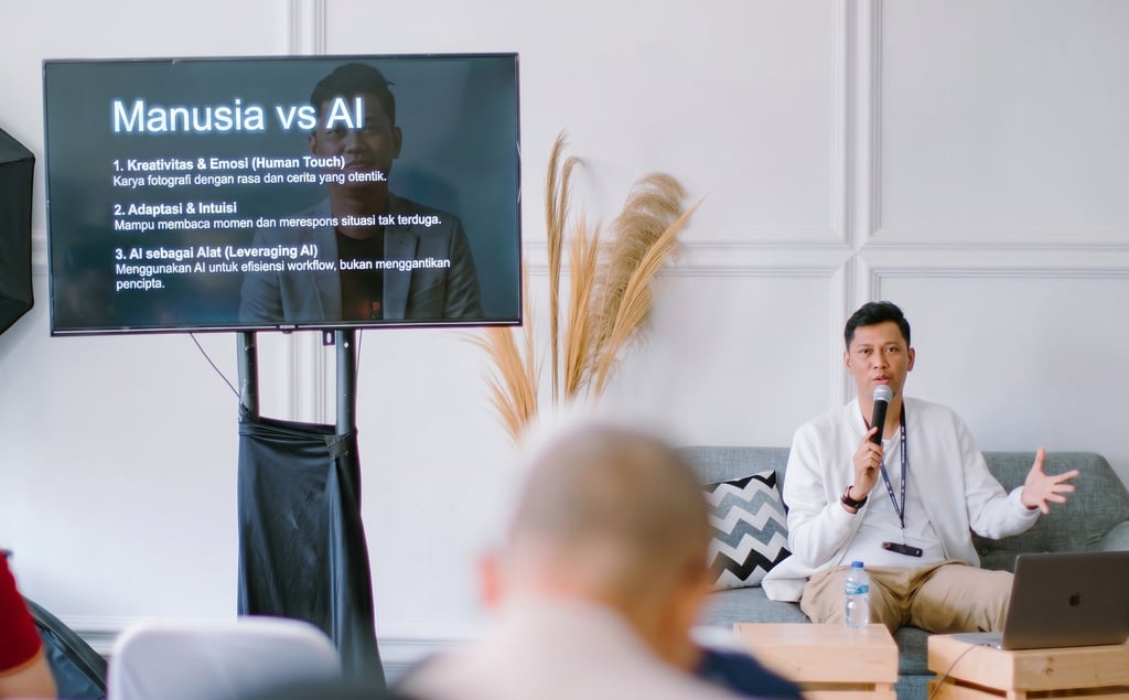 Professional speaker presenting Manusia vs AI lecture with a digital screen and microphone at a seminar.