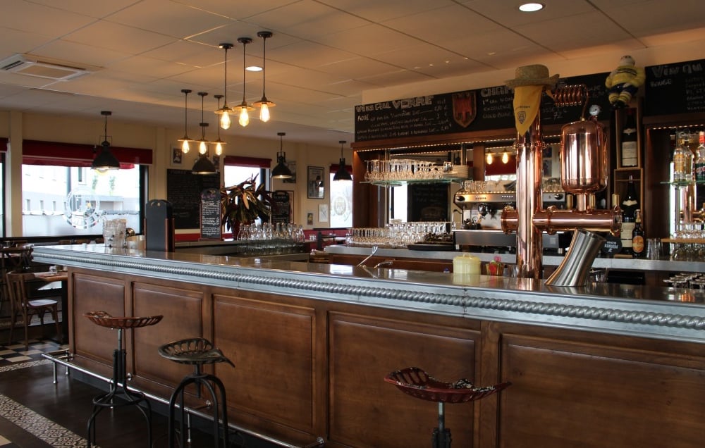 a bar with a bar stool and bar stools