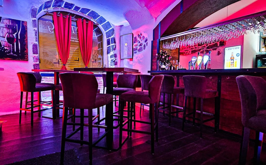 a bar with a bar stool and a bar stool