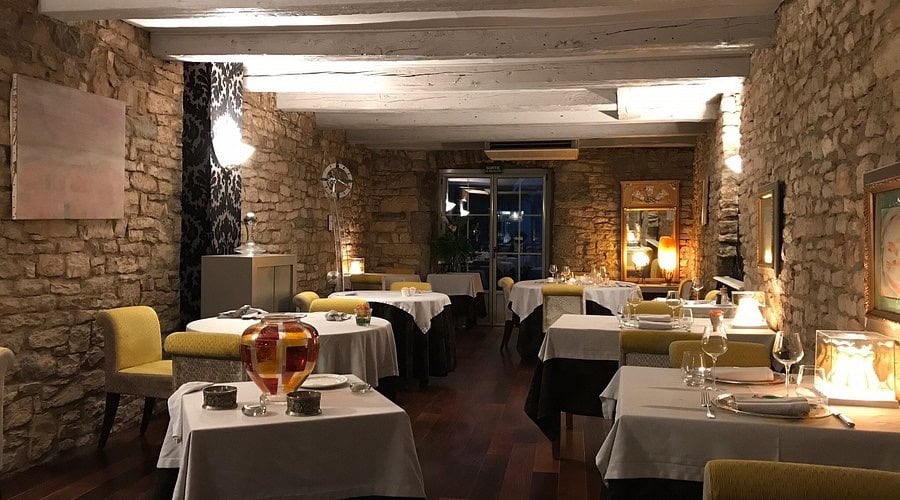 a restaurant with tables and chairs and a table